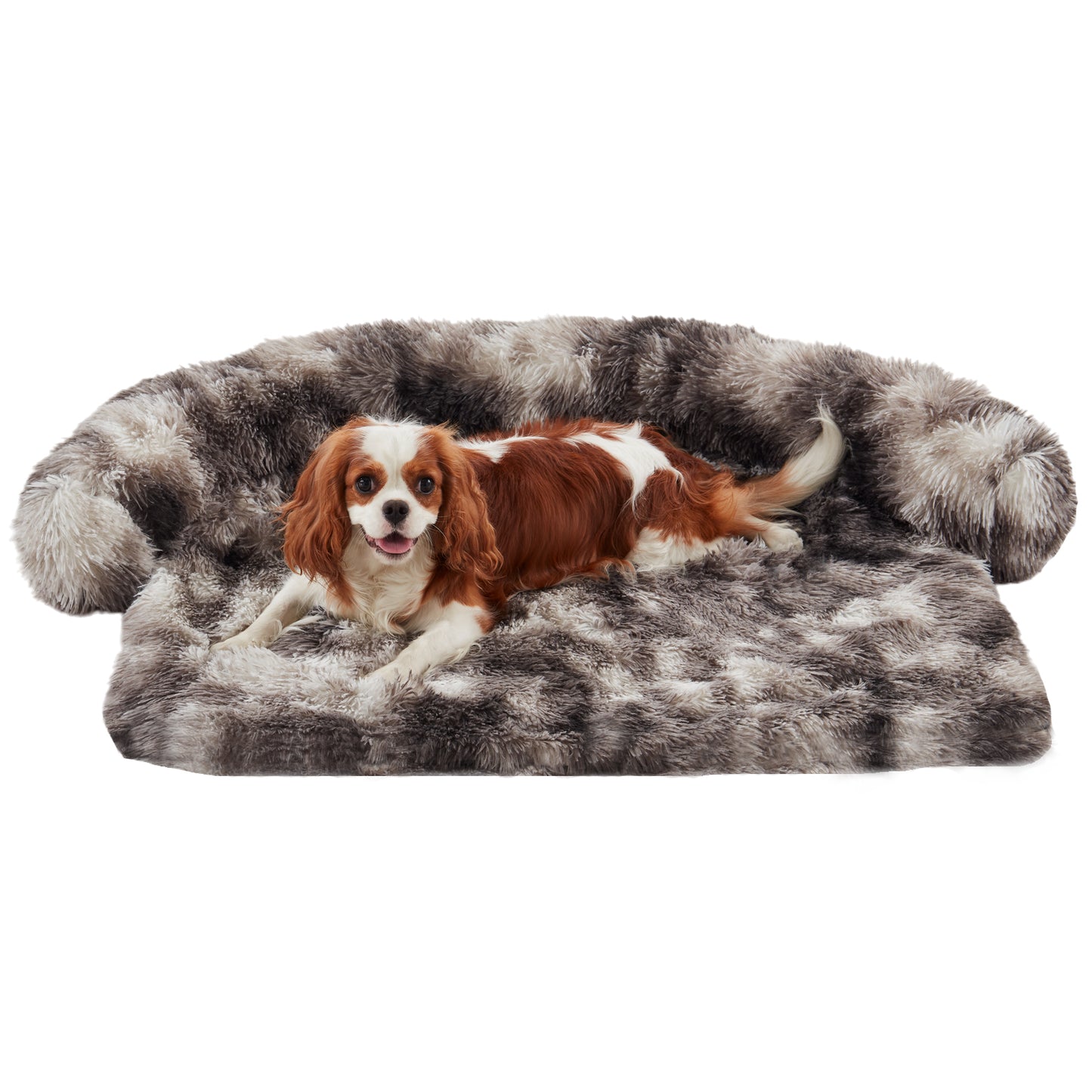 Charles spaniel dog resting on Inspaws faux long fur couch cover in ink tie-dye on white background