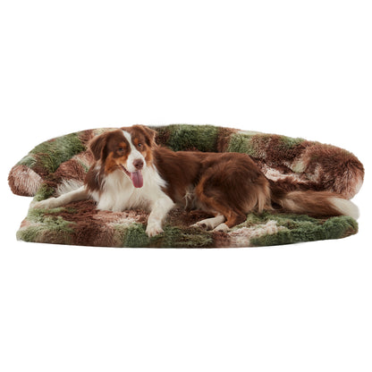 Dog lounging on Inspaws green camo fluffy faux fur couch cover sofa bed on white background