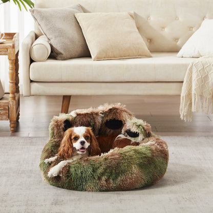 Charles spaniel dog resting in Inspaws green camo plush faux fur calming paw dog bed on living room floor