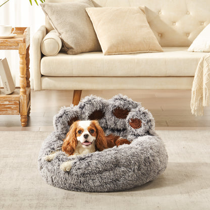 Charles spaniel dog resting in Inspaws gradient grey frost plush faux fur calming paw dog bed on living room floor