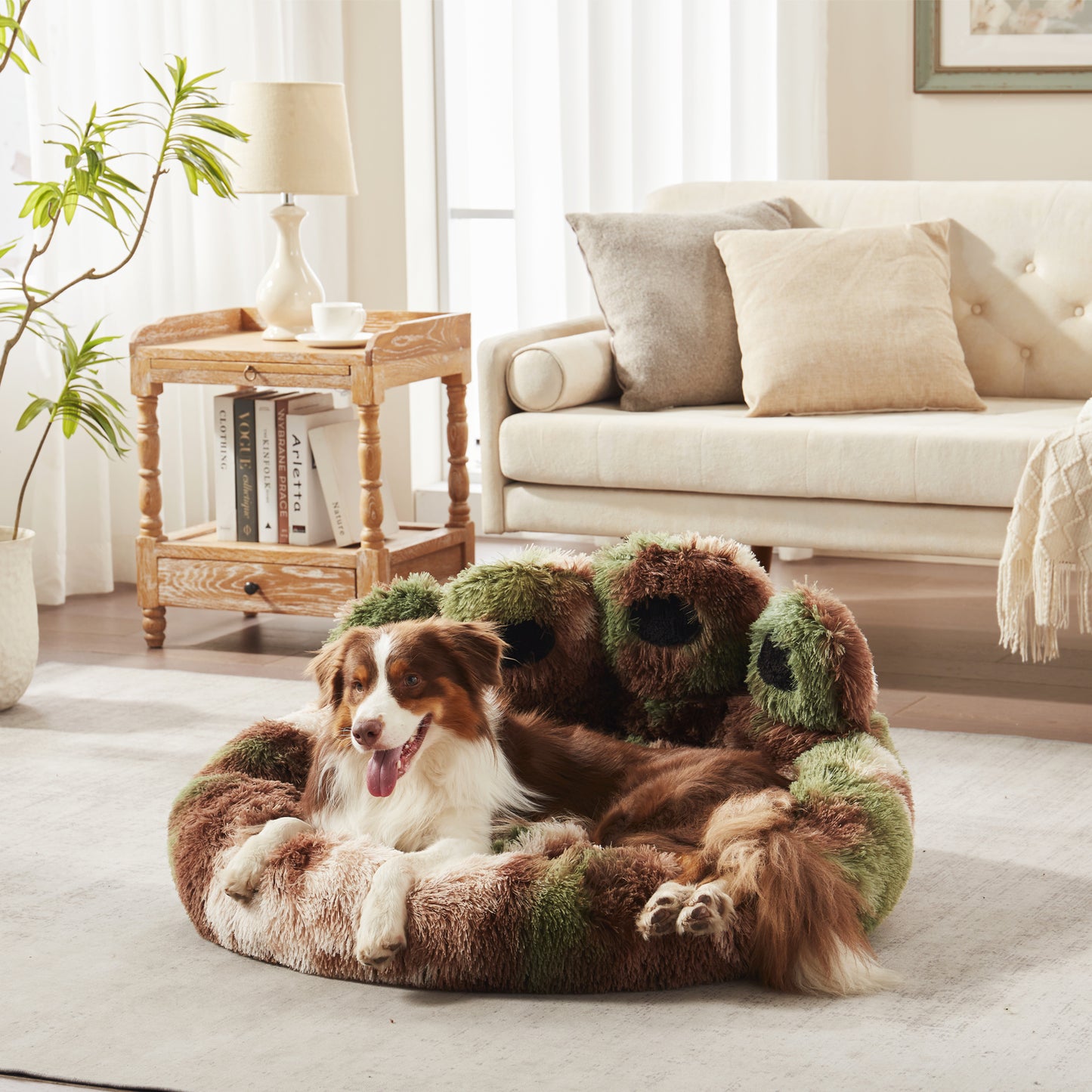 Border collie dog resting in Inspaws green camo plush faux fur calming paw dog bed on living room floor