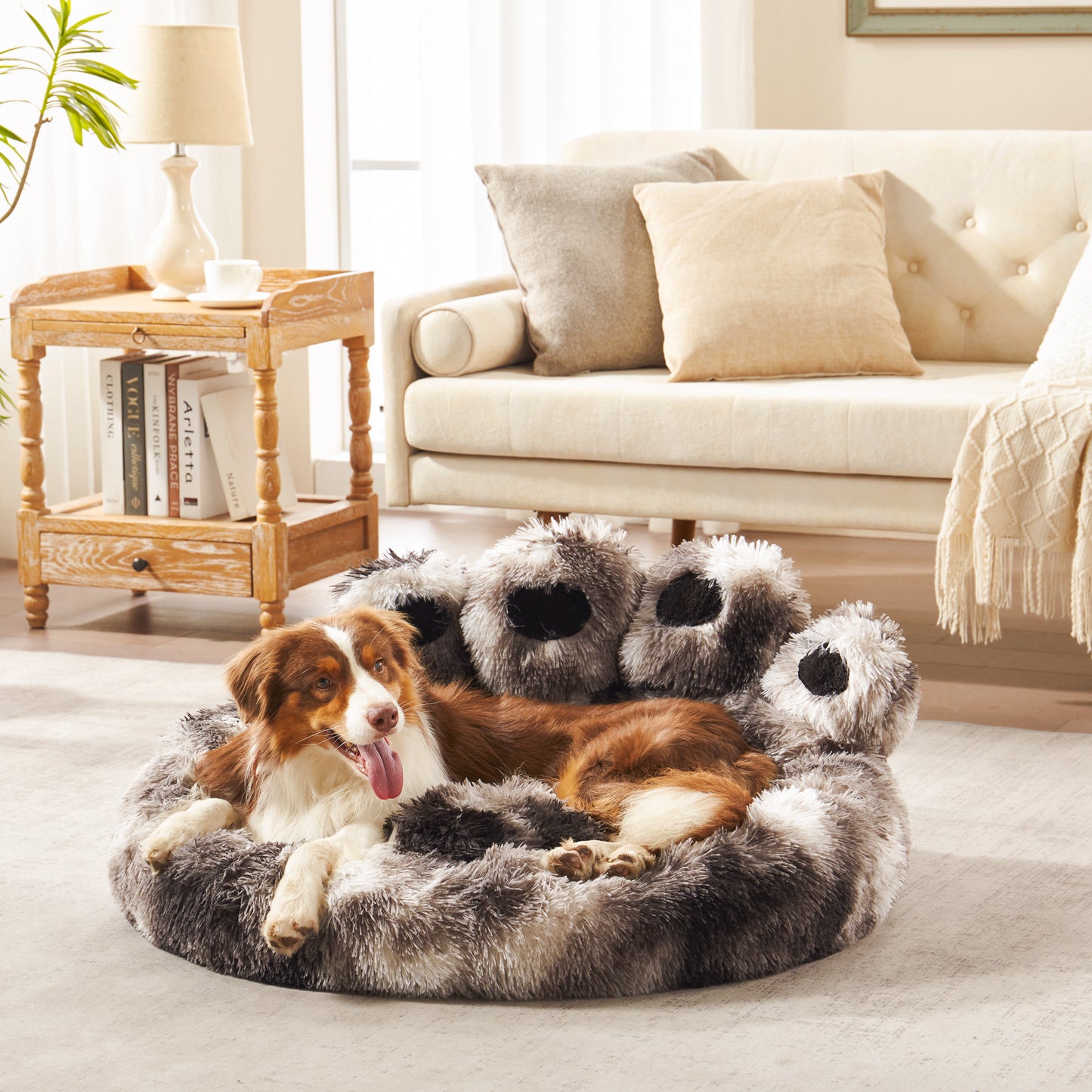 Dog lounging in Inspaws ink tie-dye plush faux fur calming paw dog bed on living room floor