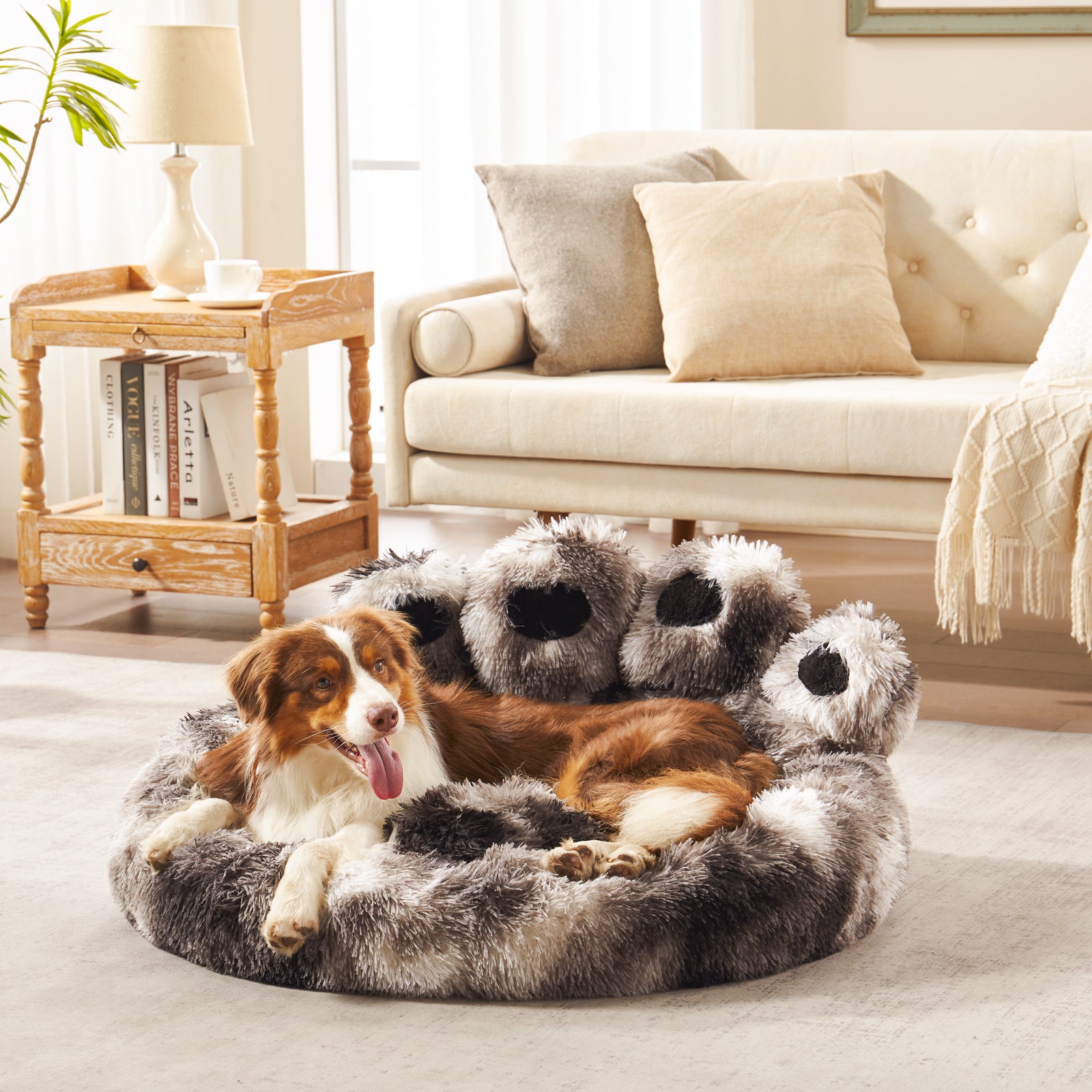 Dog lounging in Inspaws ink tie-dye plush faux fur calming paw dog bed on living room floor