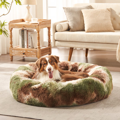 Dog resting in Inspaws calming donut dog bed in green camo plush faux fur