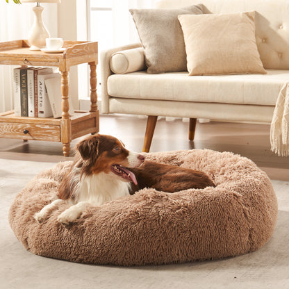 Dog resting in Inspaws calming donut dog bed in brown plush faux fur